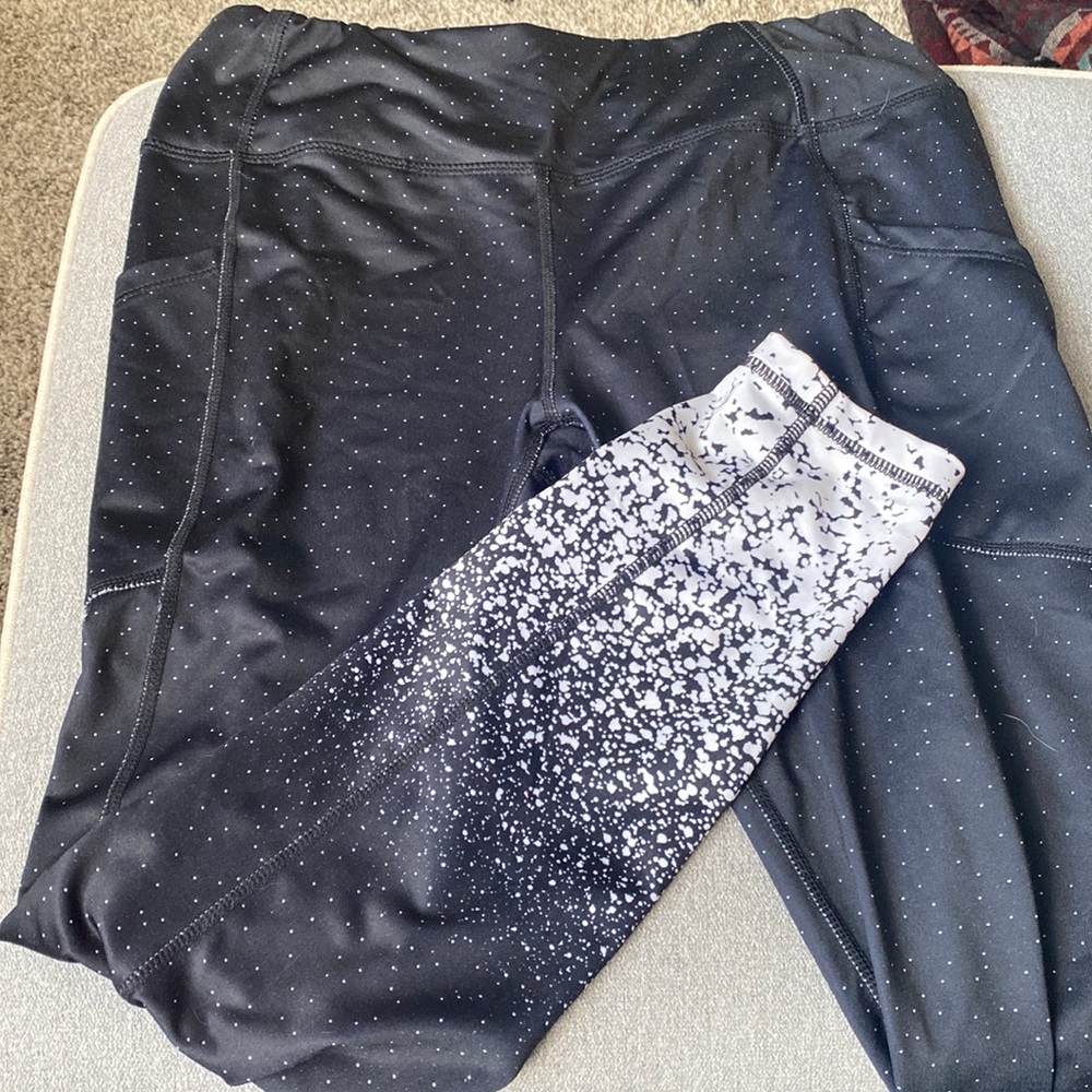 Athletic leggings with a polkadots/splatter pattern. Super cute and comfortable.